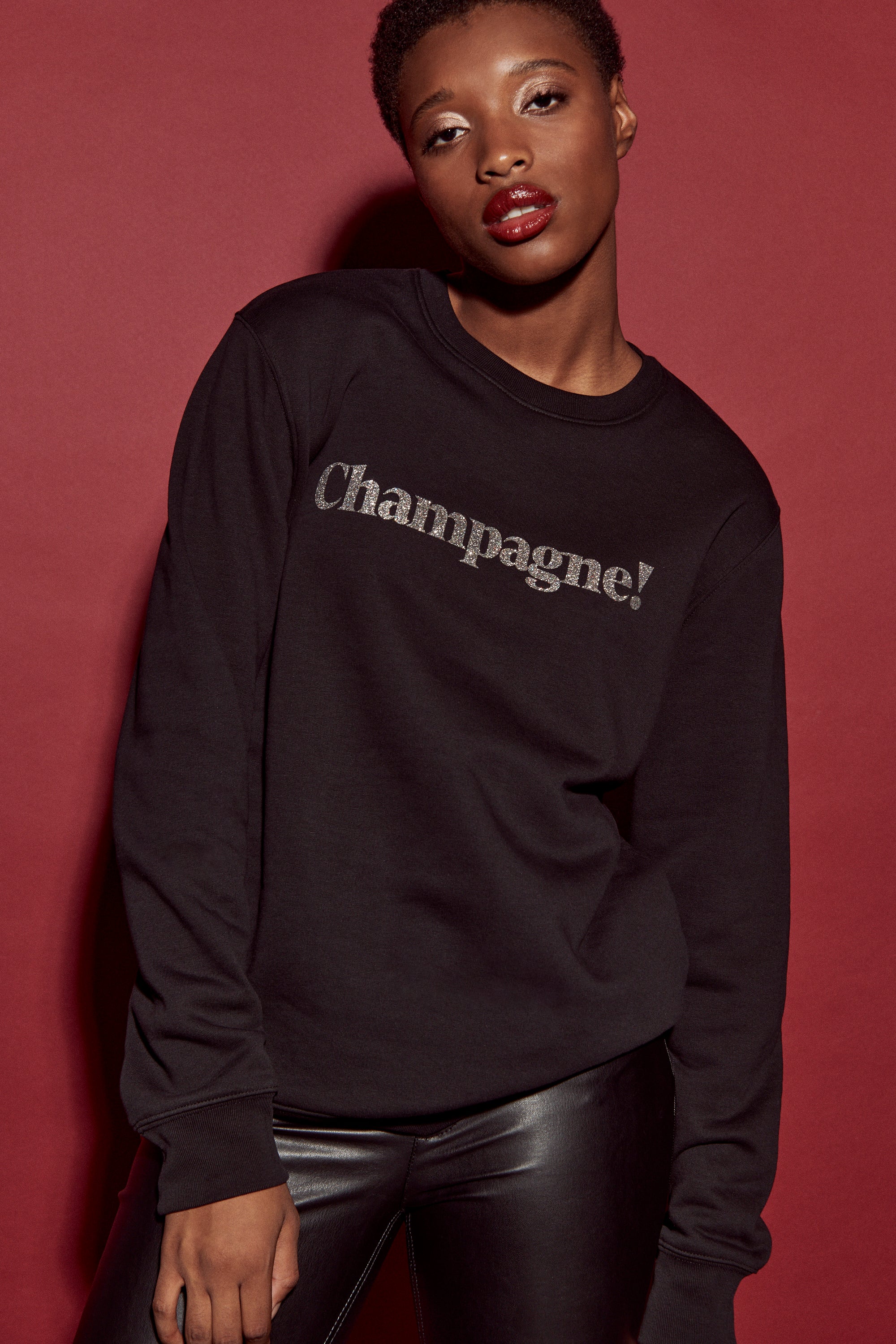 Champagne. Pullover schwarz / Glitzer